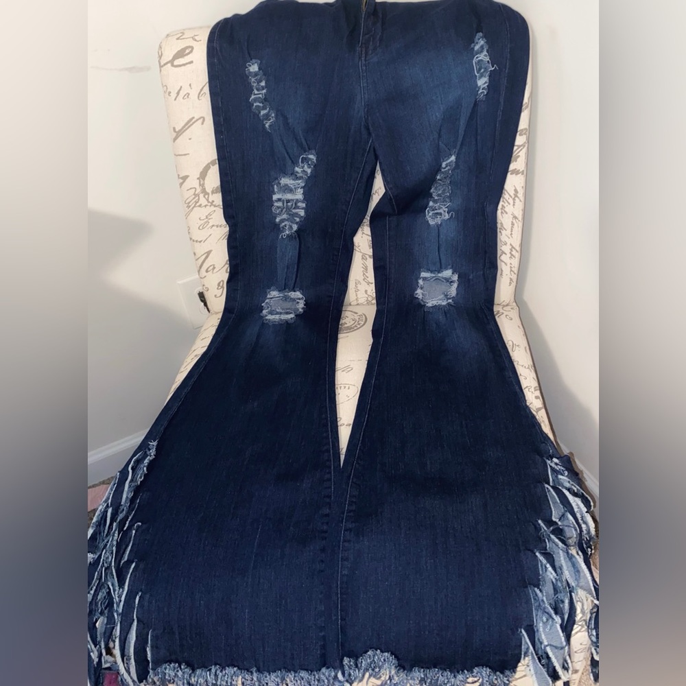 Dark blue ripped bell bottom jeans